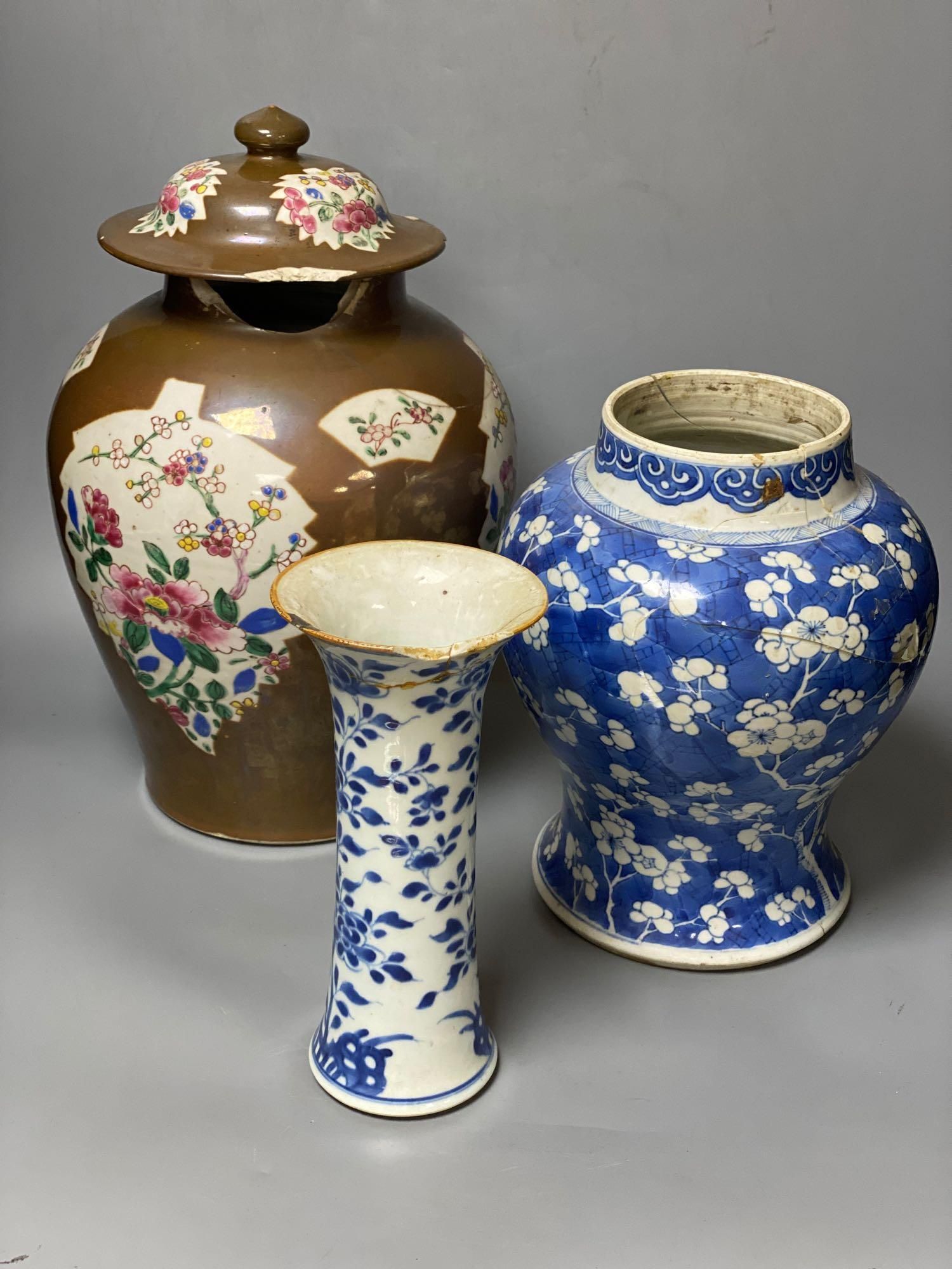 Two Chinese Kangxi period blue and white vases and a Qianlong Batavia vase and cover, largest 36cm high including the cover